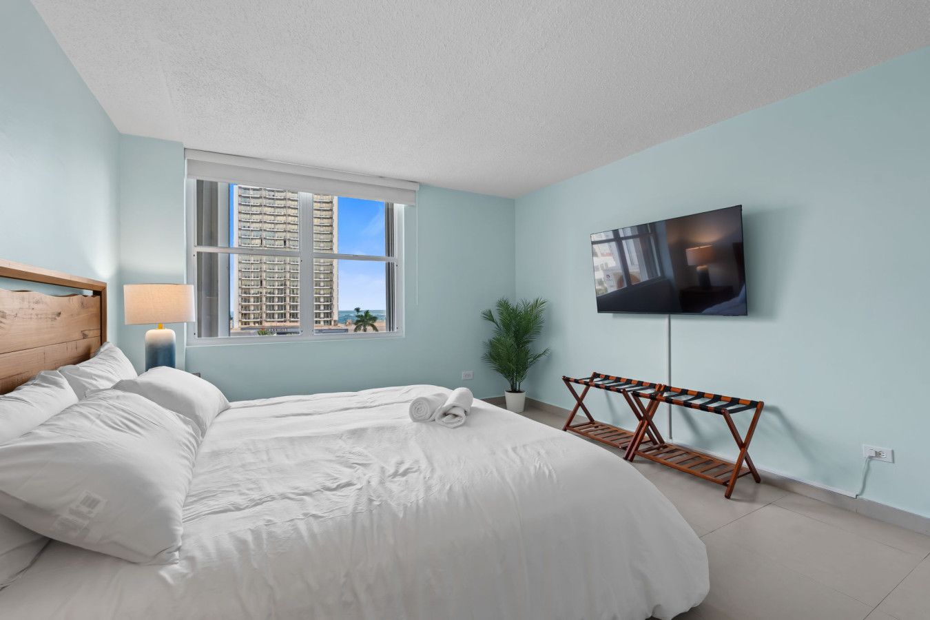 King bedroom in the Condado condo with private bathroom and ocean view