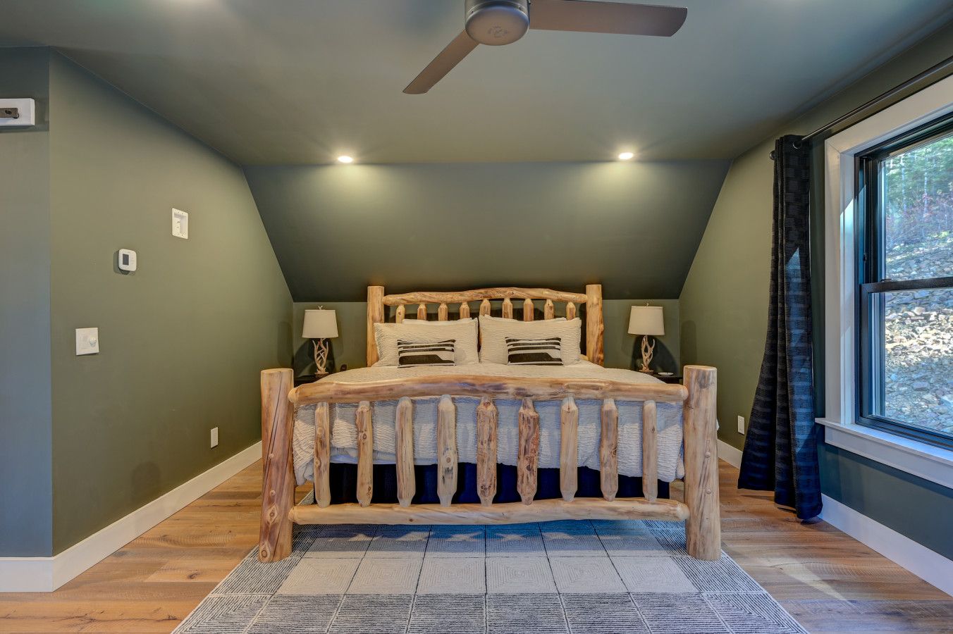 King bed w/ attached private full-bathroom on the upper floor