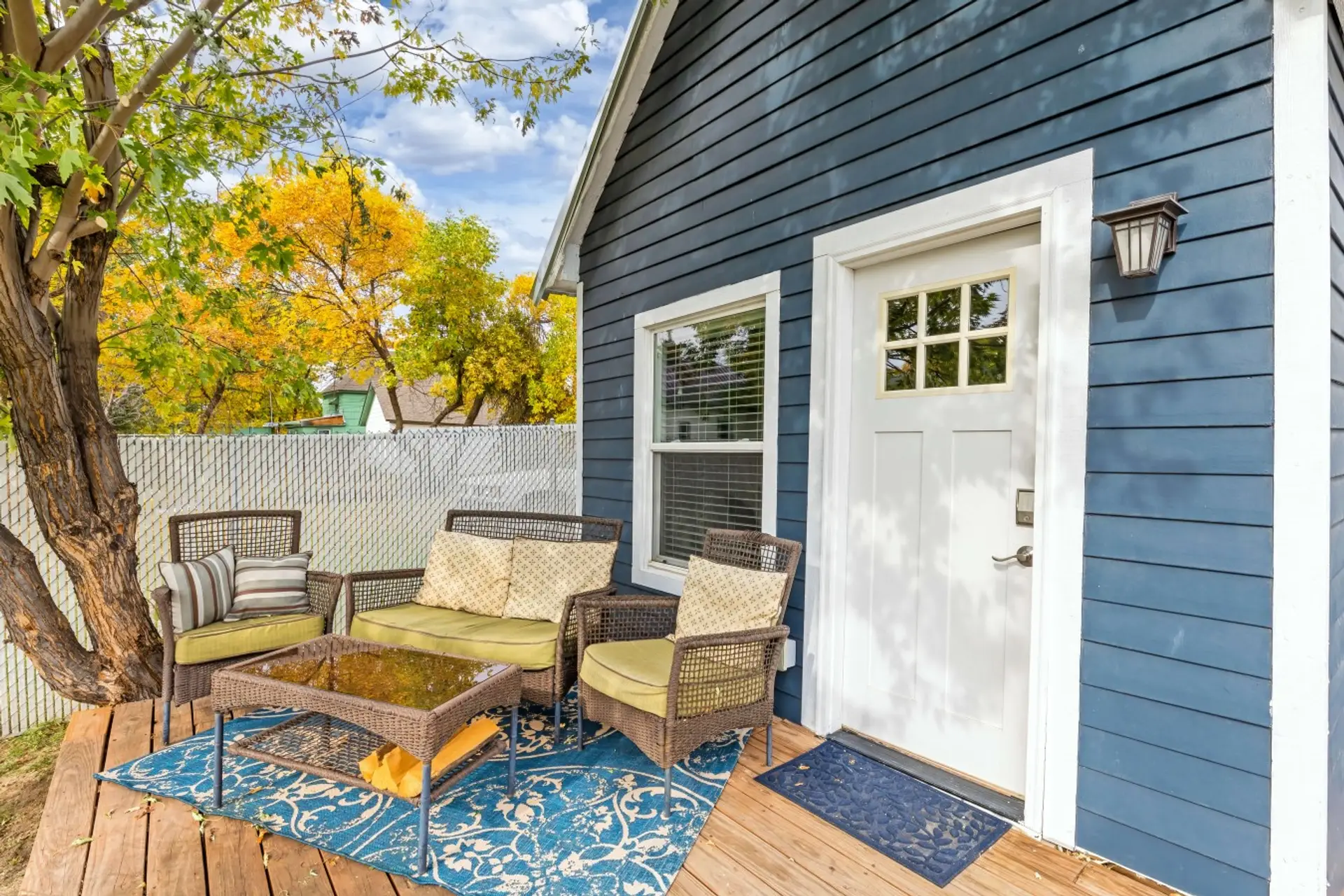 Outdoor patio with seating at Cozy Great Falls Retreat by Wrecked & Refined. Designed for relaxing mornings and quiet evenings.