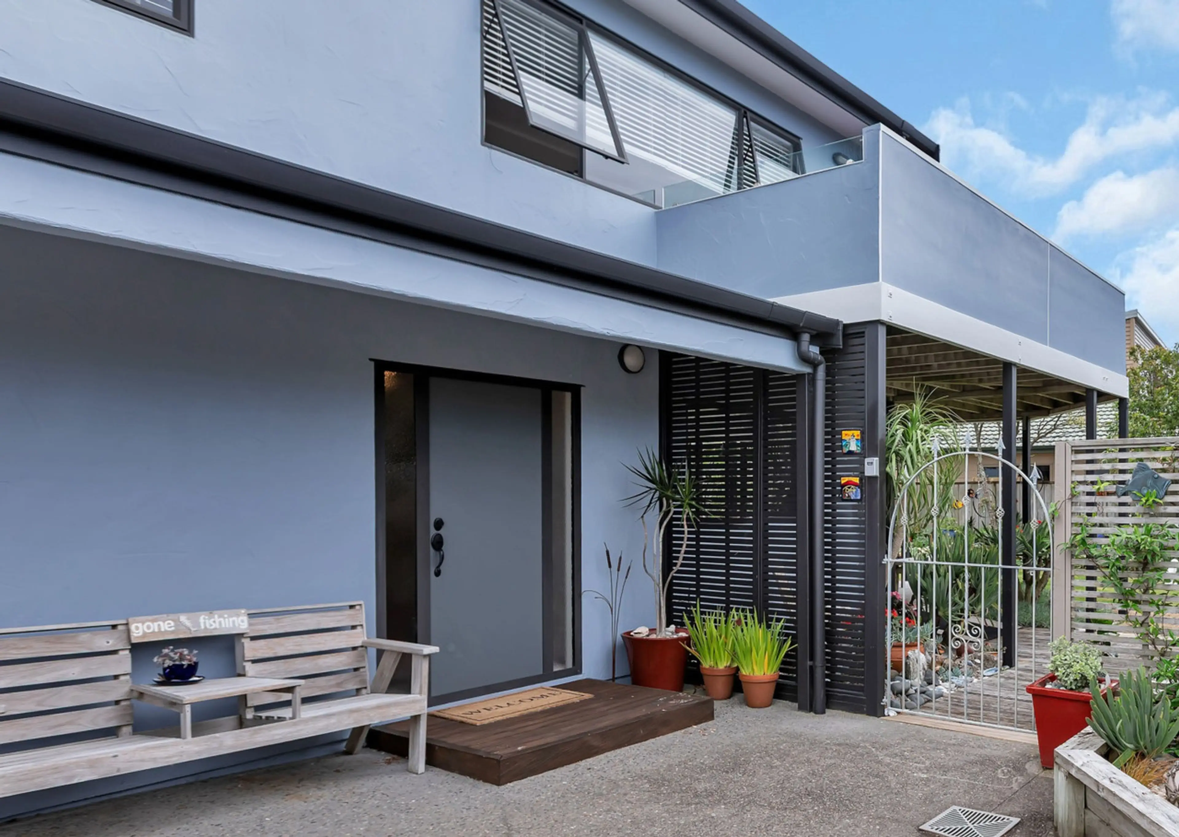 Private entrance to Surfside, with easy self check-in and a peaceful garden setting