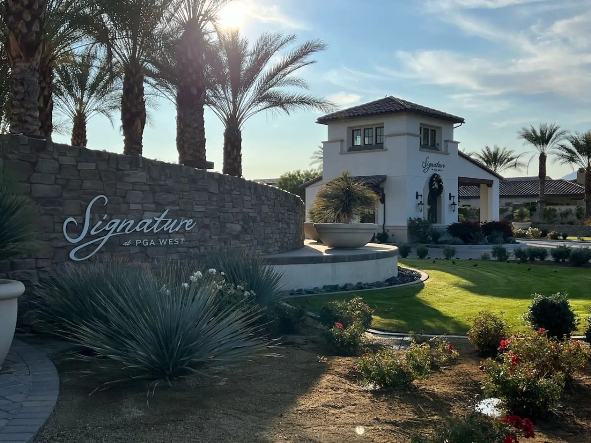 Welcoming community entrance w/ landscaped grounds & signature signage