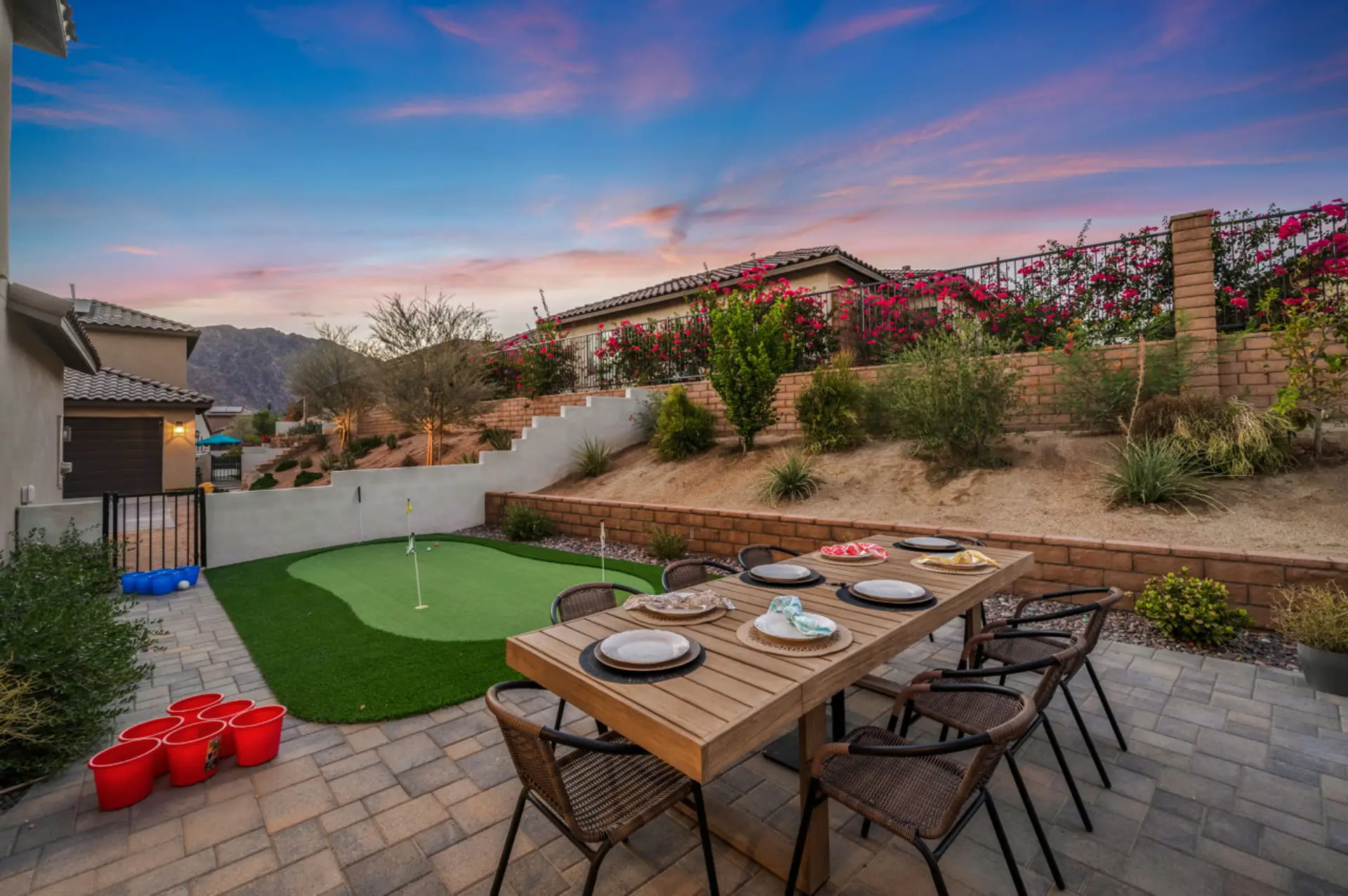 Spacious backyard w/ turf, dining area & room to gather under the sky