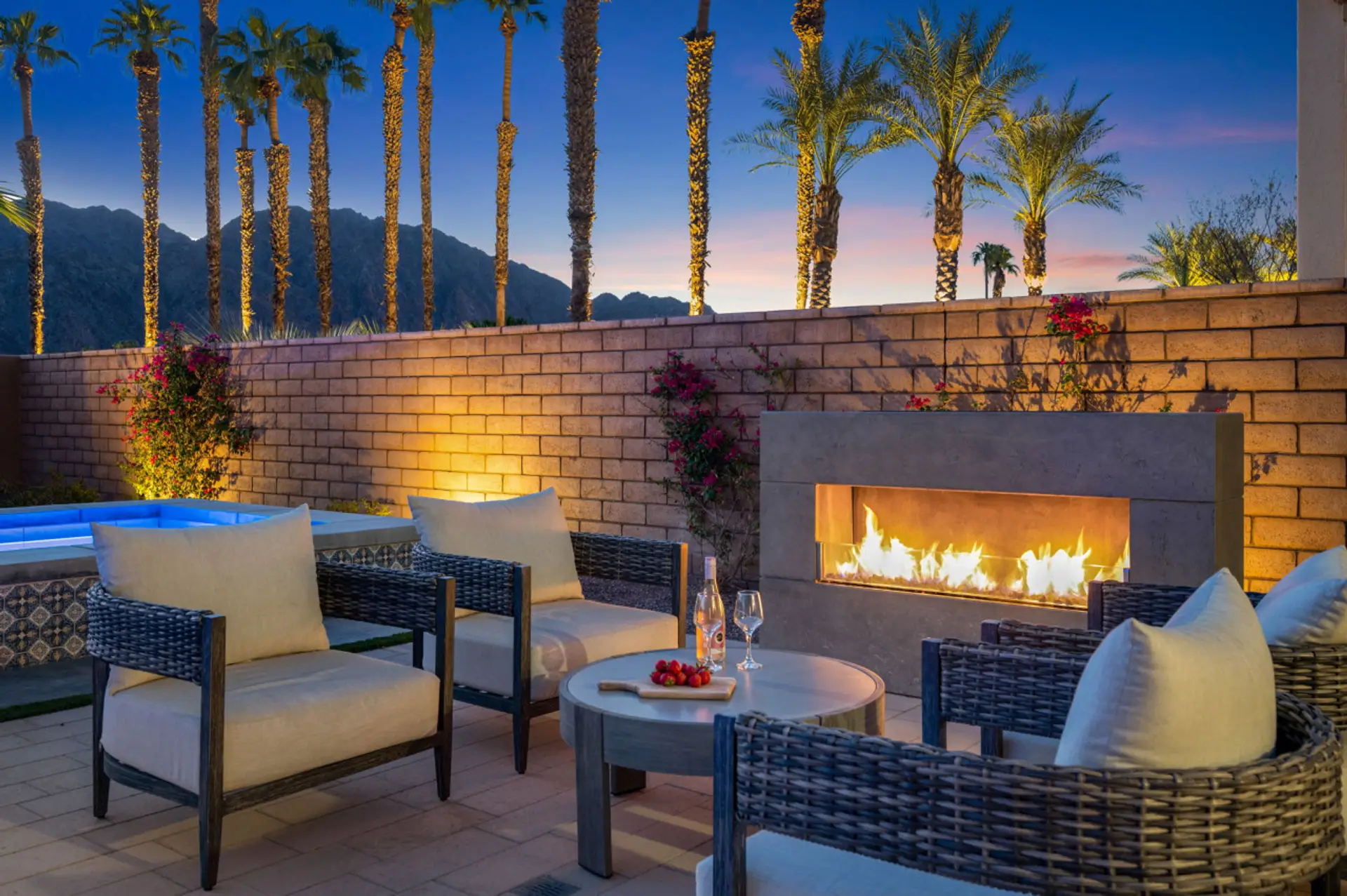 Cozy outdoor firepit lounge w/ cushioned seating for relaxed nights under the stars