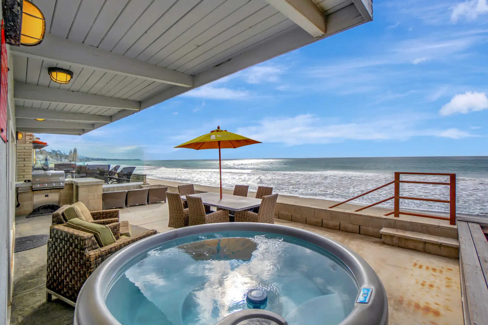 Oceanfront hot tub on the deck, ideal for soaking in the views
