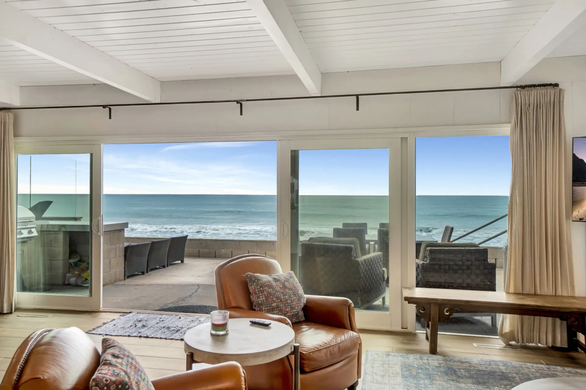 Airy bedroom w/ seating nook & direct access to a private balcony