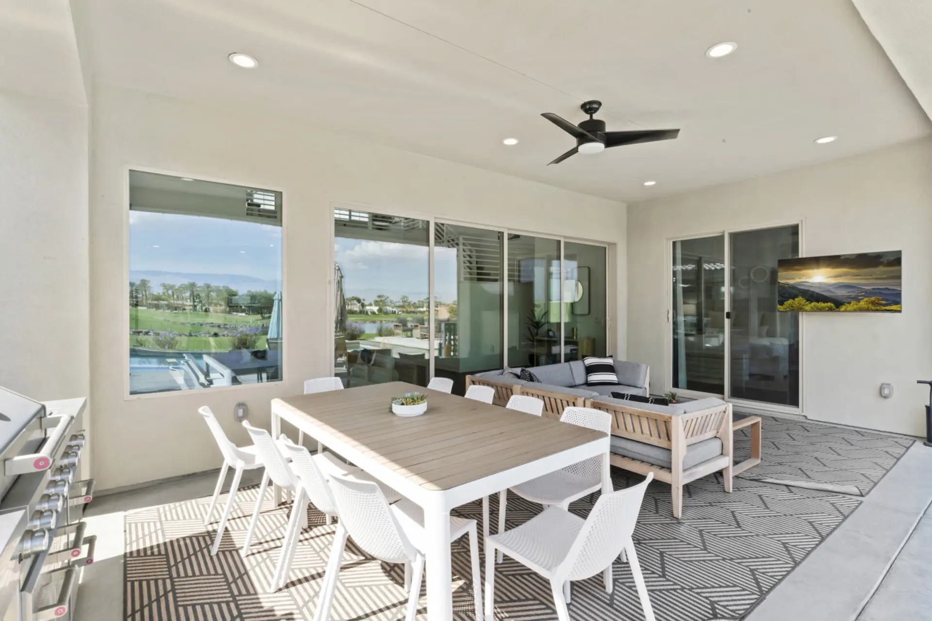 Dine al fresco by the pool w/ shaded seating & easy indoor-outdoor access.