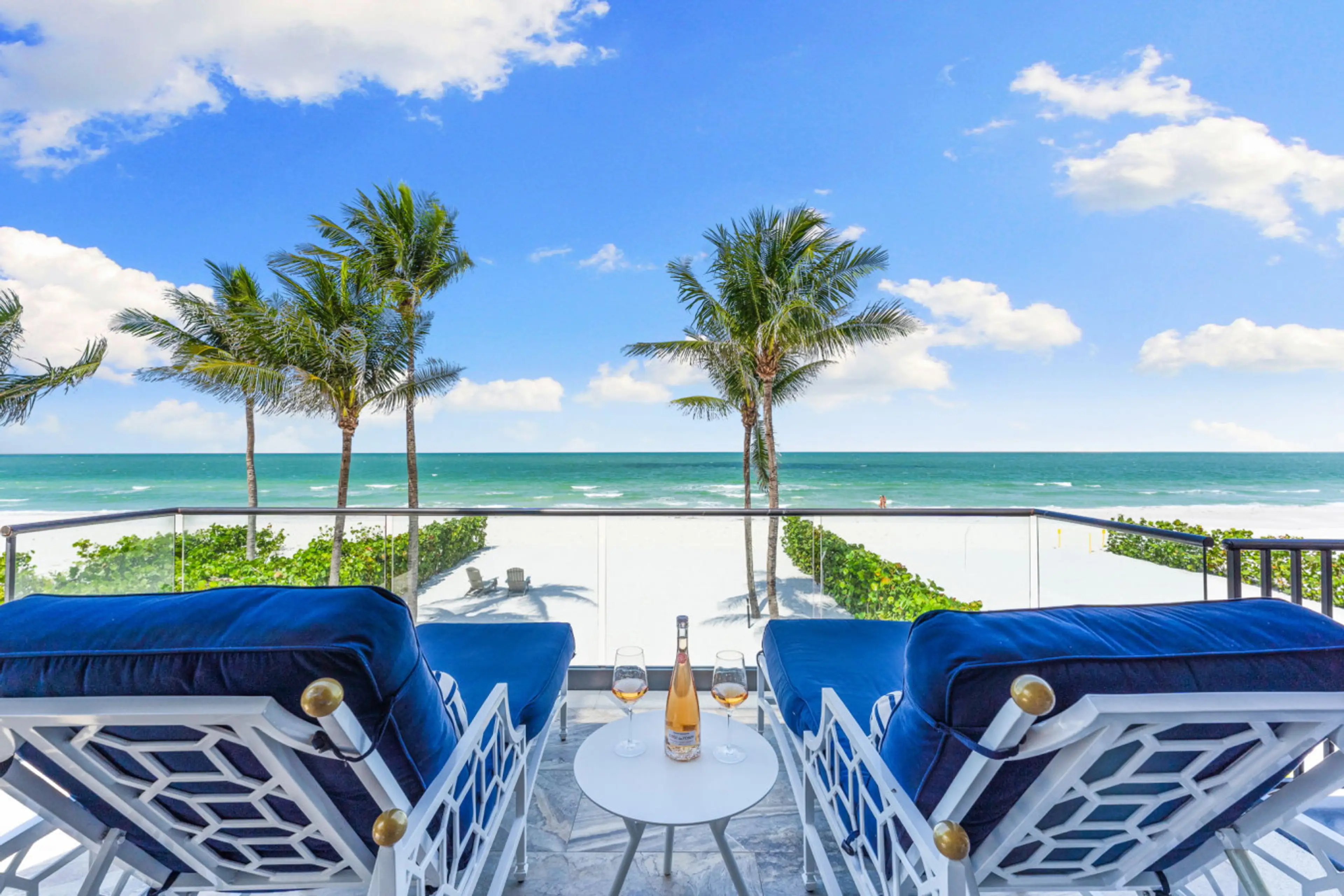 Savor a drink and soak in paradise from your front-row beach view.