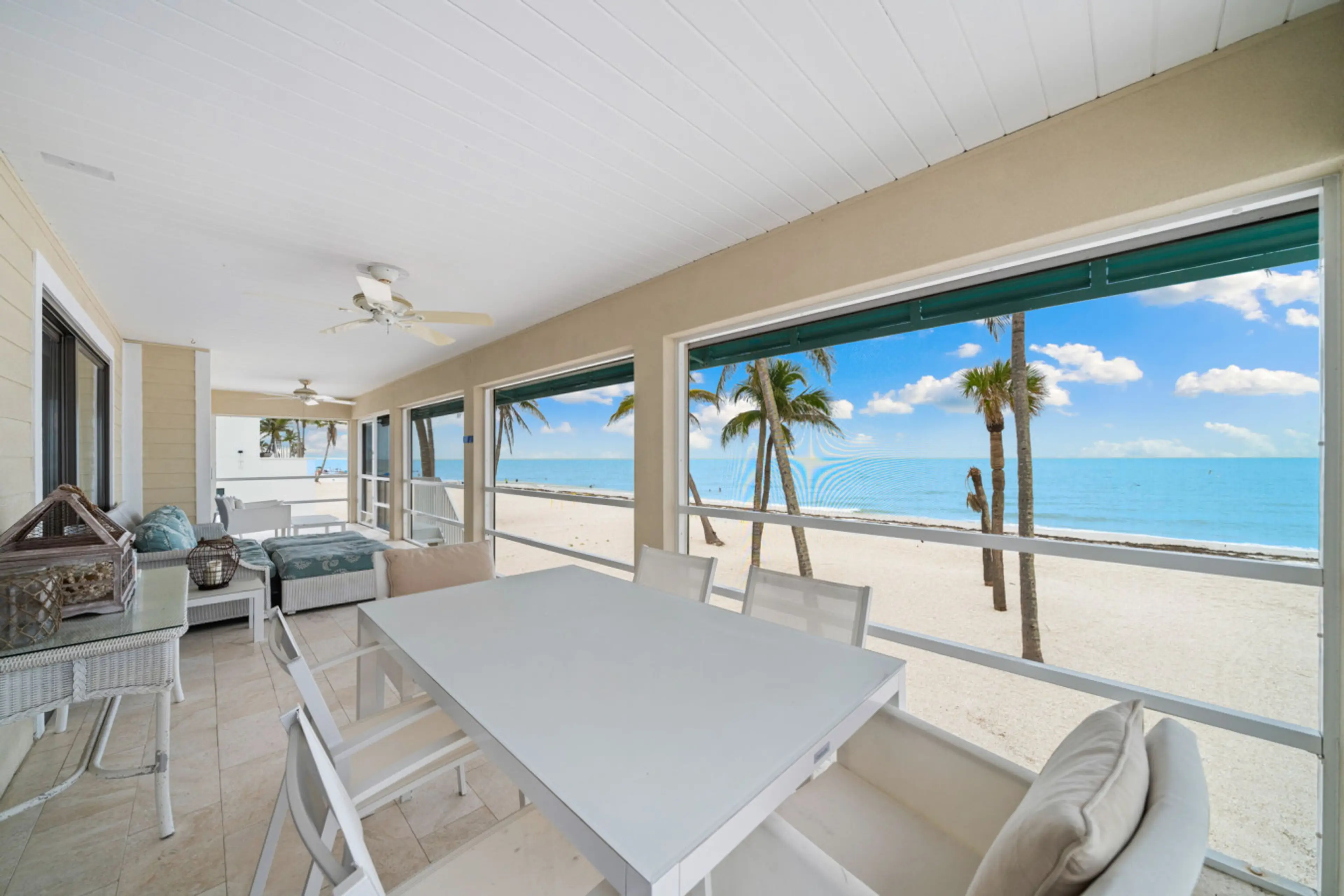 Share meals just steps from the sand at this breezy oceanside dining table