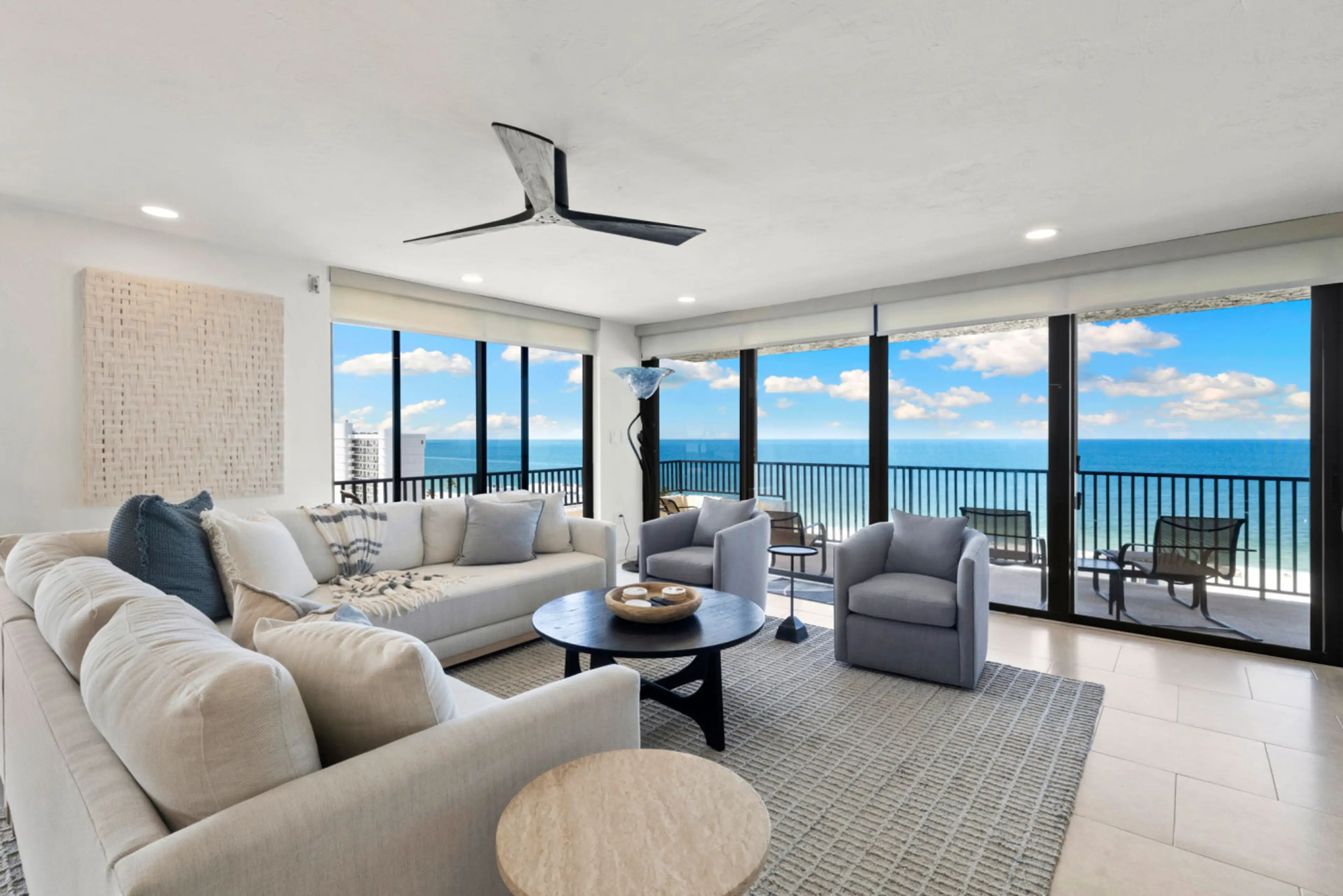 Unwind in this airy coastal lounge with sweeping Gulf views in every direction