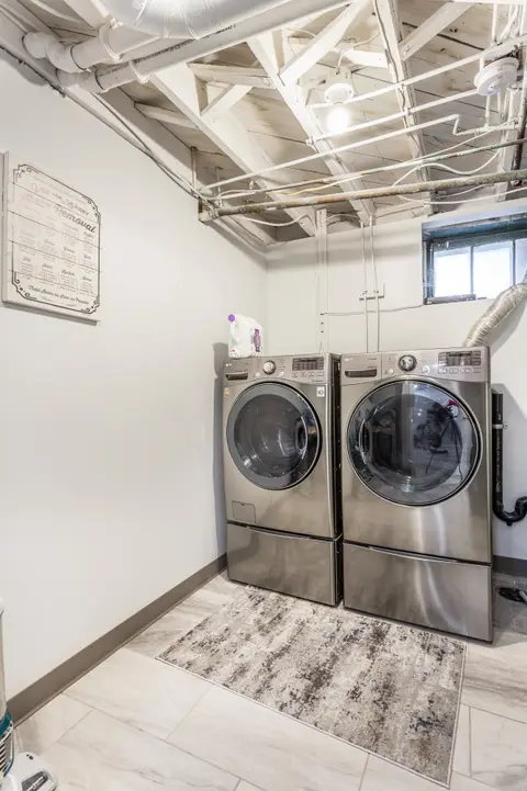 Laundry room with a front-loading washer and dryer