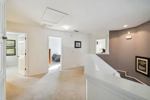 Upstairs hallway leading to the bedrooms and bathrooms