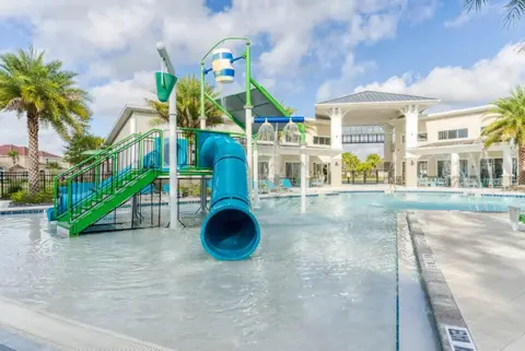 Veranda Palms community water park with a slide and a splash pool