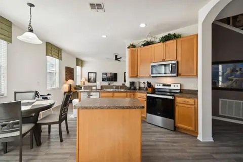 Kitchen with an island and a round breakfast table