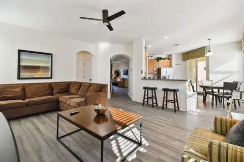 Family room with a sectional sofa, open to the kitchen and breakfast bar