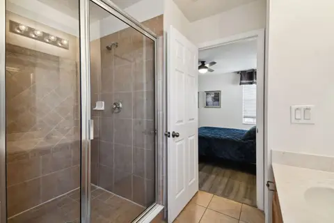 Bathroom with a glass-enclosed walk-in shower