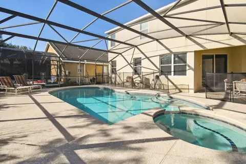 Pool and hot tub, with the back of the house behind