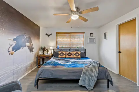 Eagle room with a king bed and a wall-mounted A/C unit