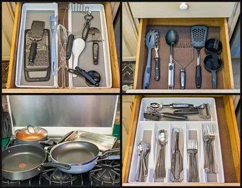 Drawers of cooking utensils, pans, and flatware