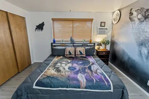 Wolf room with dreamcatcher bedding and a wall A/C unit