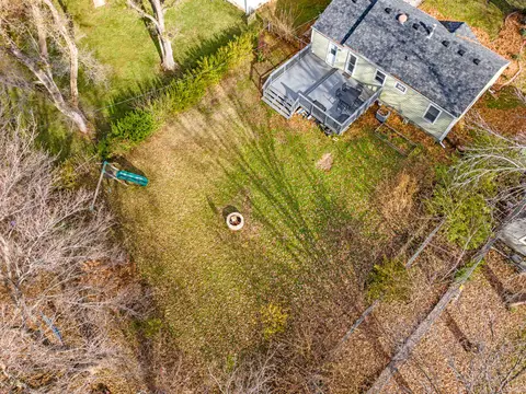 Overhead view of the backyard, with the fire pit and the slide