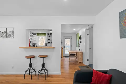 Bar stools at the pass-through from the living room into the kitchen
