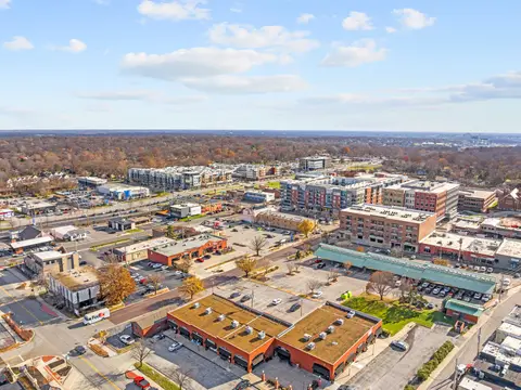 Aerial view of shops, apartments, and parking in Overland Park