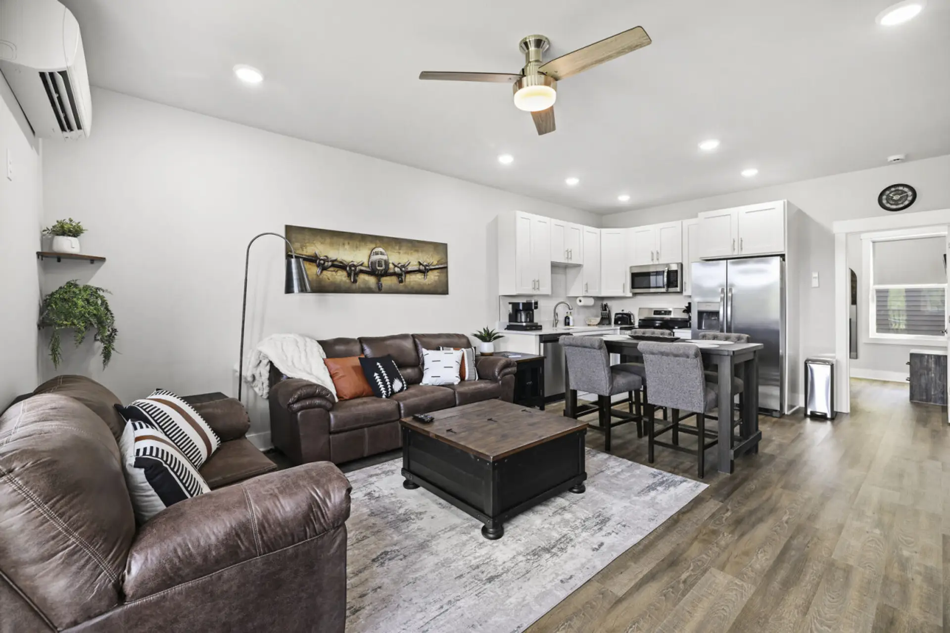 Living Room & Kitchen – Relax in this stylish open-concept space with modern finishes.
