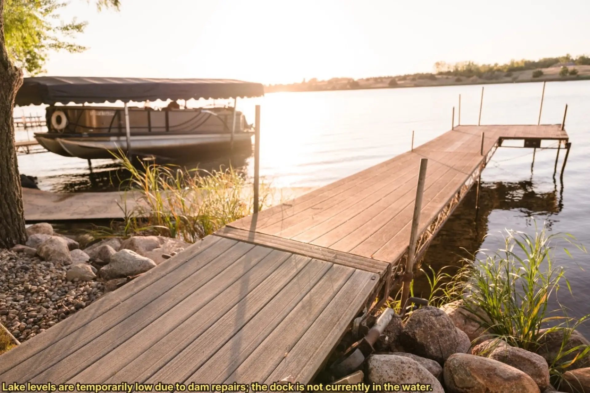 Lake levels are temporarily low due to dam repairs; the dock is not currently in the water.