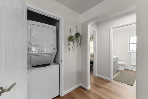 Stacked washer and dryer in a hallway closet