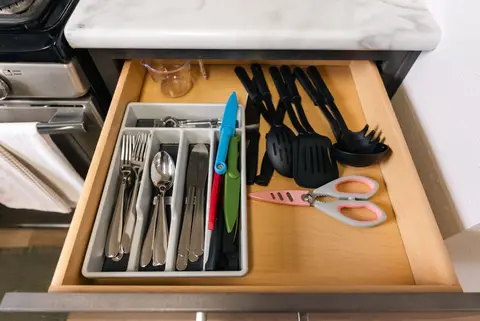 Drawer with cutlery, cooking utensils, and kitchen scissors
