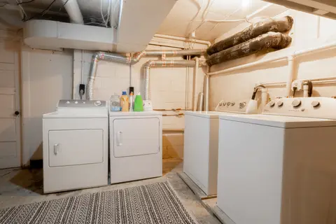 Shared laundry room in the lower level, with washers and dryers