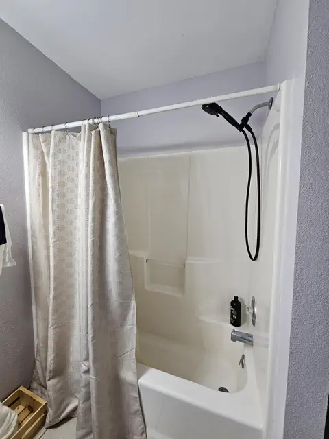 Tub and shower with a handheld showerhead