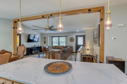 Kitchen island with a woven centerpiece, looking across to the living room