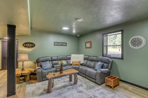 Gray reclining sectional around a log coffee table