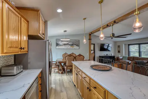 Kitchen counter with a toaster, looking toward the dining and living areas