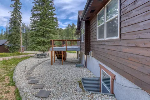 Gravel side yard with stepping stones beside the house