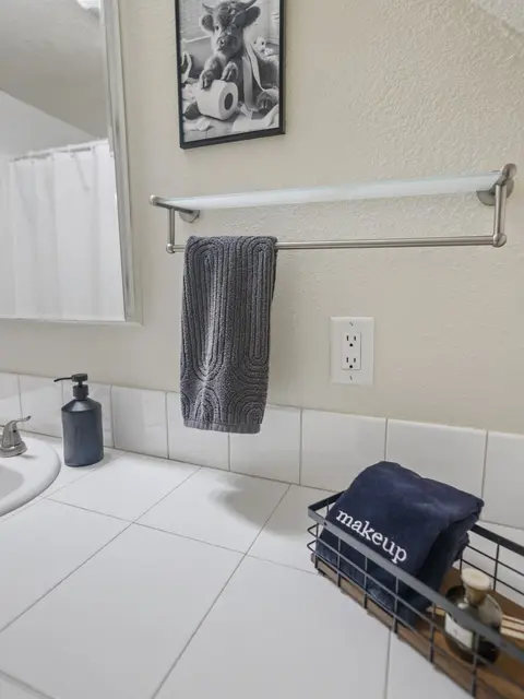 Bathroom sink with a hand towel and soap