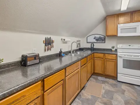 Kitchen counter with a toaster, a knife strip, and the range
