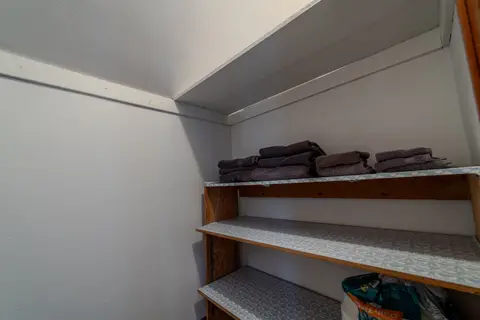 Built-in shelves with folded towels