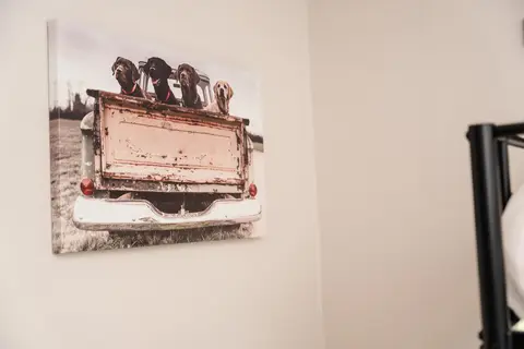 Canvas print of a vintage truck on a bedroom wall