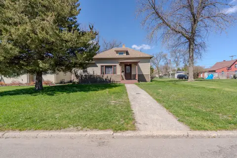 Front walk leading to the house across a wide lawn