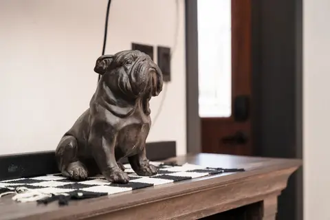 Bulldog statue on a table runner