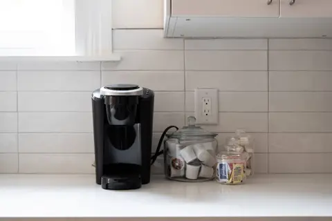 Coffee station stocked with pods and supplies