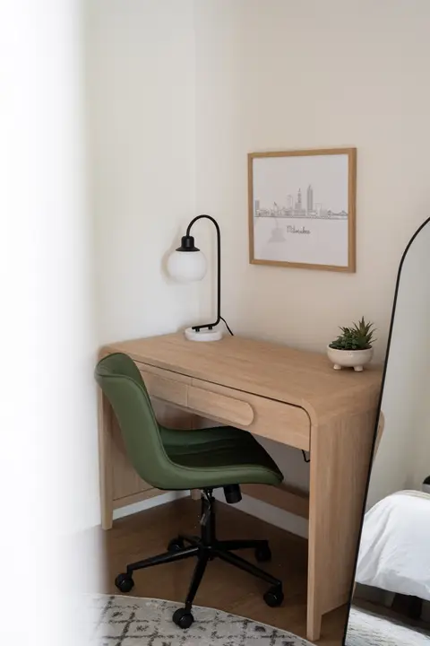 Bedroom workspace with a desk and an office chair