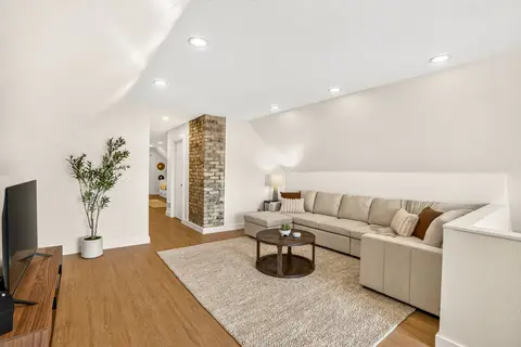 Upper-level lounge with a large sectional