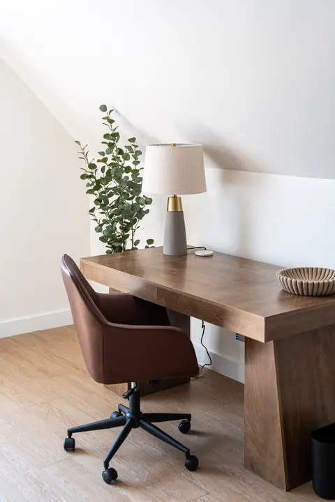 Upper-level workspace with a desk and a chair