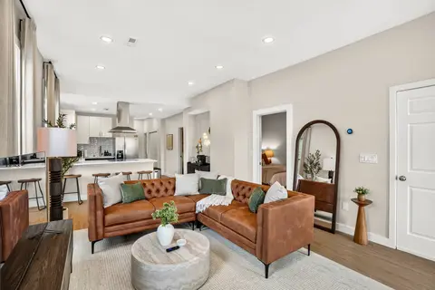 Open living space with seating, connected to the kitchen