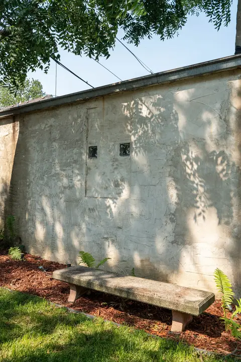 Backyard detail with the surrounding historic property and mature shade trees