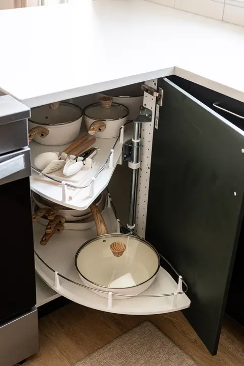 Kitchen stocked with cookware and utensils