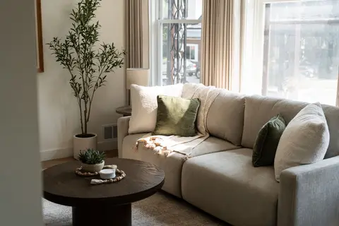 Sunlit living room with a sectional